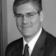 Research Director Sean O'Malley's headshot in black and white.